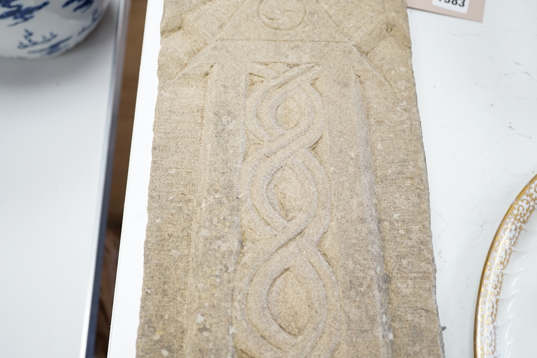 A carved stone Celtic cross, 56 x 18cm. Condition - good